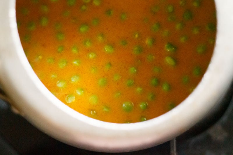 Top shot of water mixed into masala paste