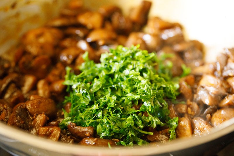 freshly minced parsley added to pan with sautéed mushrooms