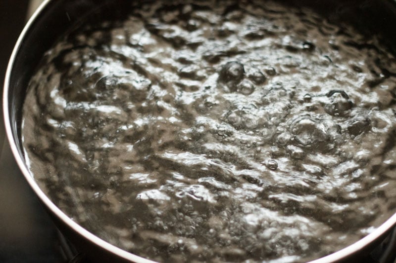 boiling water in a black pan