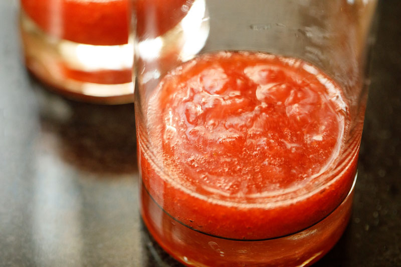 strawberry syrup added to a collins glass