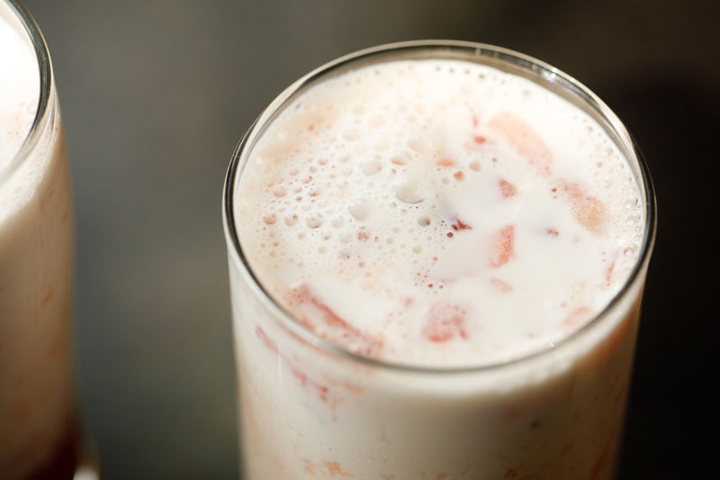 close up shot of assembled strawberry milk in a clear glass