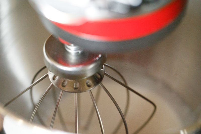 cream being whipped in stand mixer