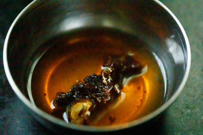dried tamarind soaking in hot water