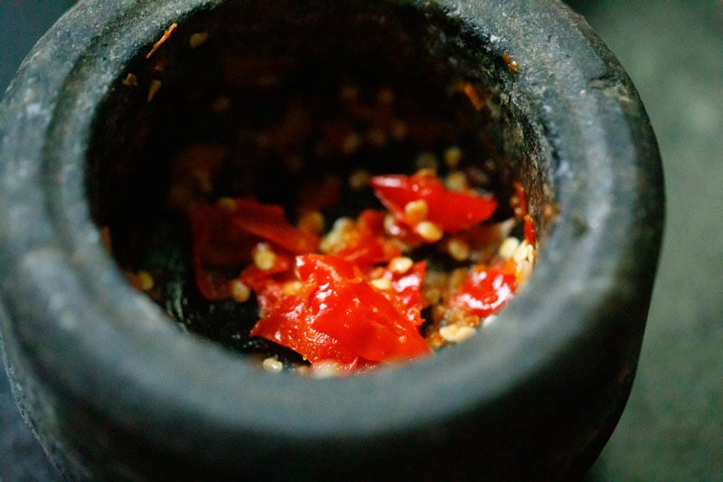 garlic and chilis after being mashed with mortar and pestle