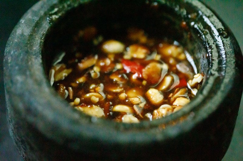 tamarind water, palm sugar, soy sauce, lemon juice and sea salt added to mashed garlic and chile