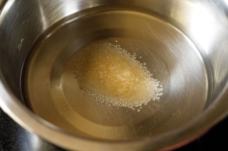 sugar in water in steel bowl.