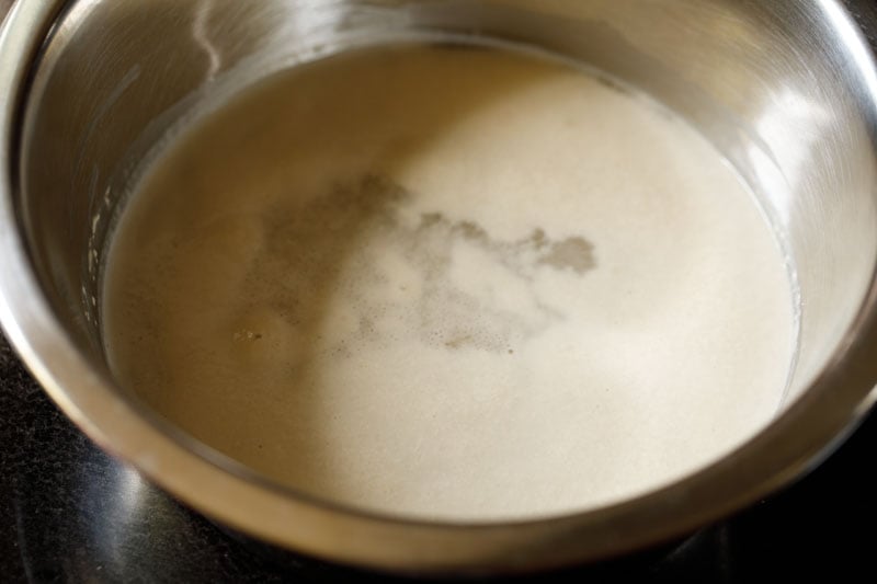 yeast mixed and frothed in bowl.