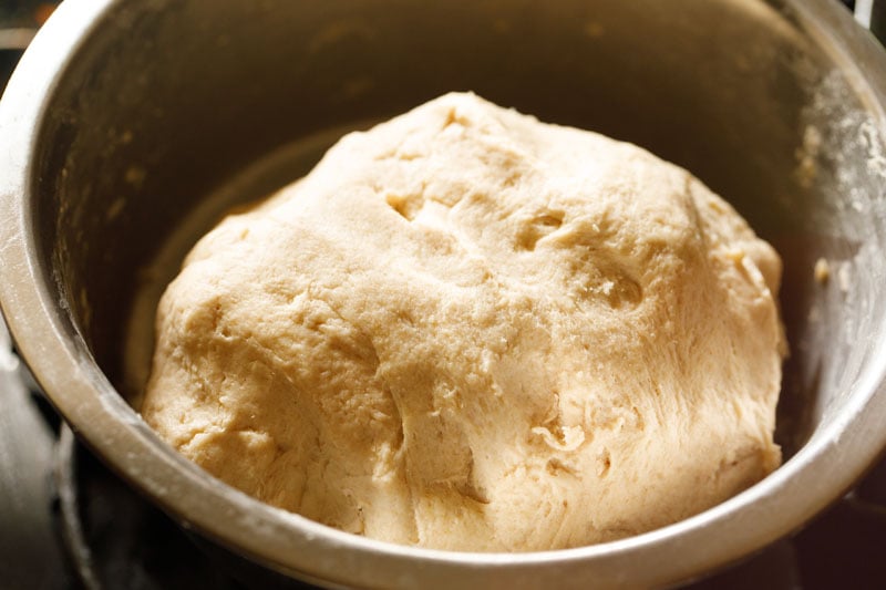 wholemeal bread dough punched and  being kneaded again.