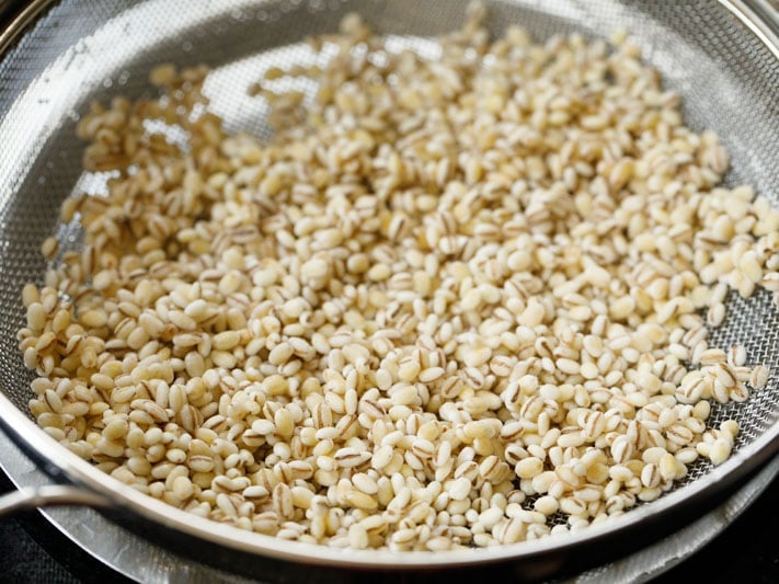 barley in a mesh strainer