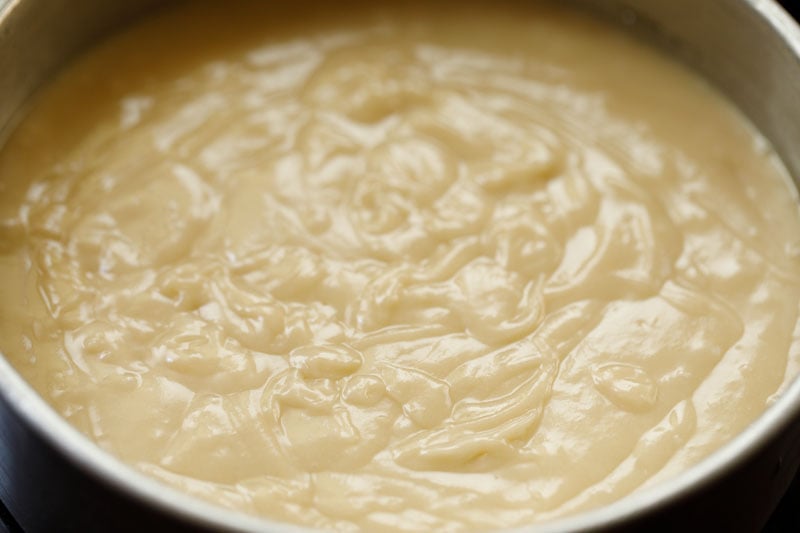 eggless vanilla cake batter added to baking pan