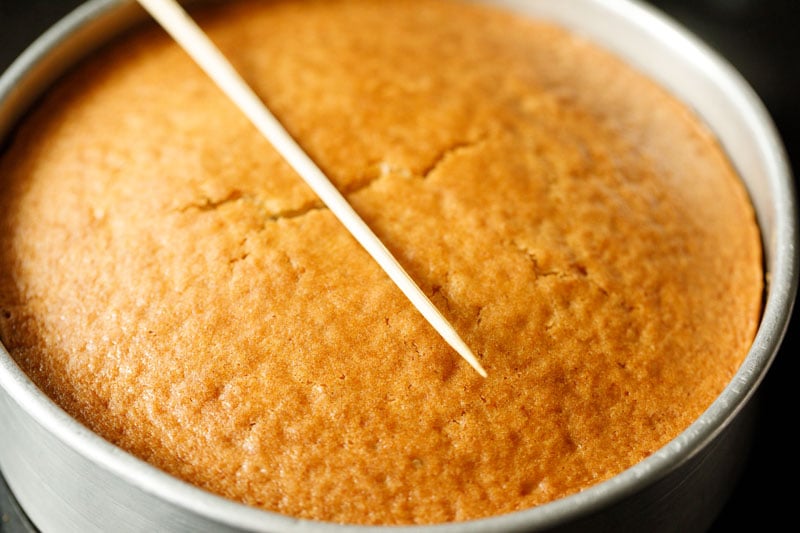 checking cake with a wooden skewer