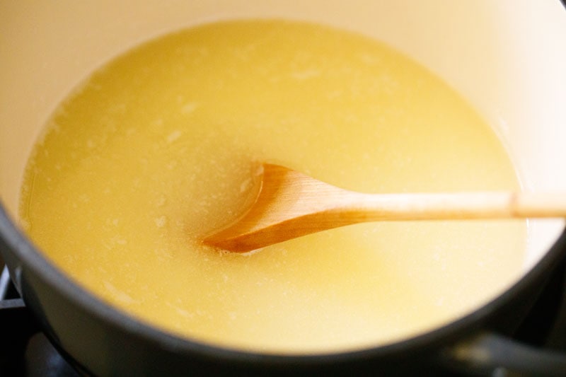 melted butter in pot with a wooden spoon