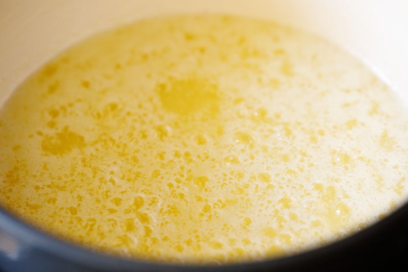 bubbles on simmering butter are less opaque now, with more yellow color showing through
