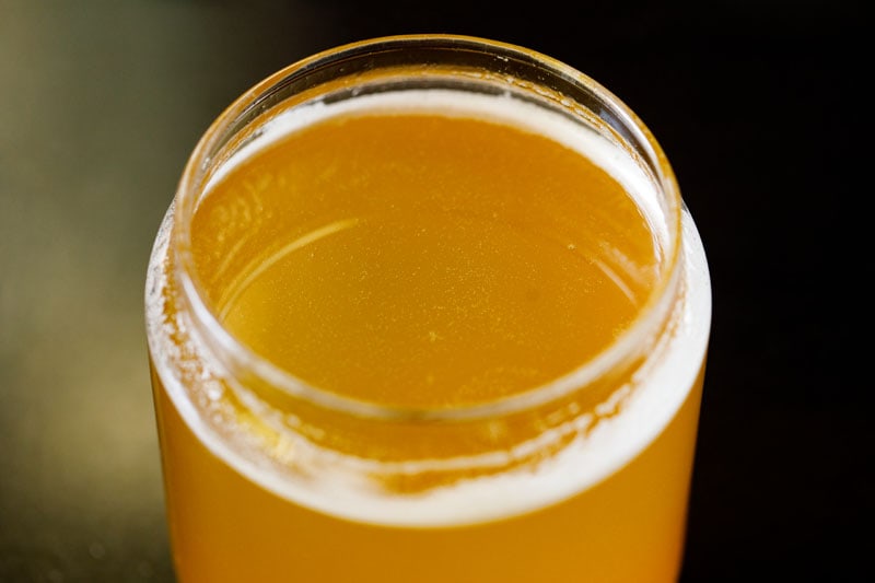 glass jar filled with golden ghee