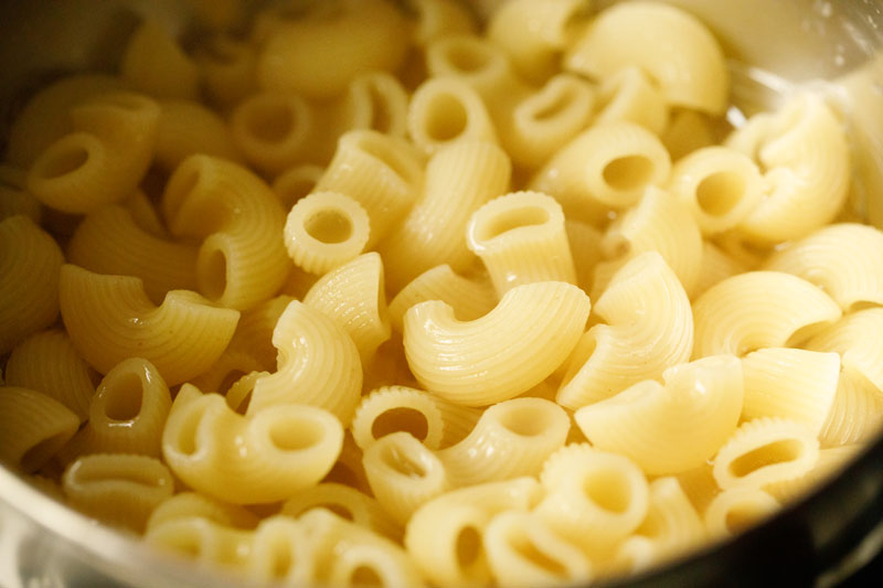 cooked, drained elbow macaroni in bowl