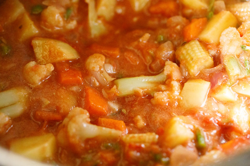 liquid added to stock pot with veggies