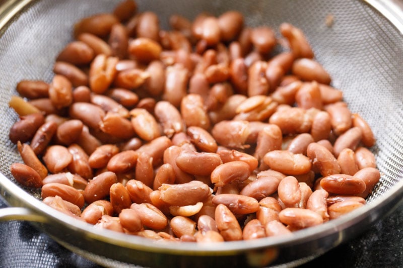 cooked red kidnes beans draining in sieve