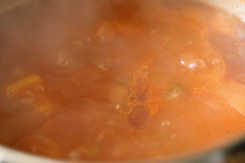 minestrone soup simmering on the stove