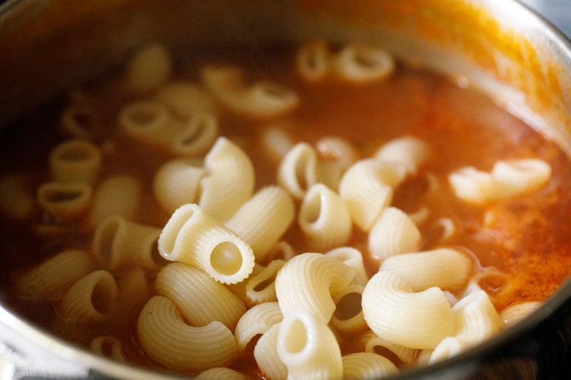 cooked elbow macaroni added to vegetable minestrone soup