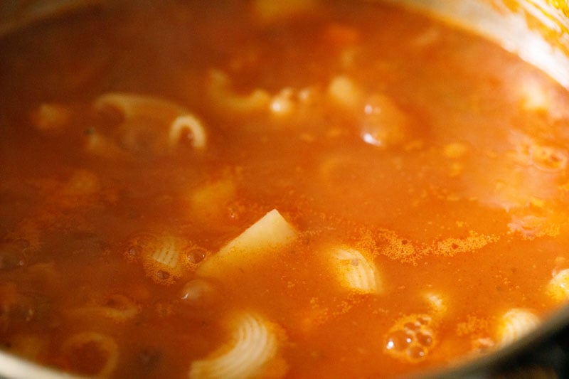 minestrone soup simmering on stove