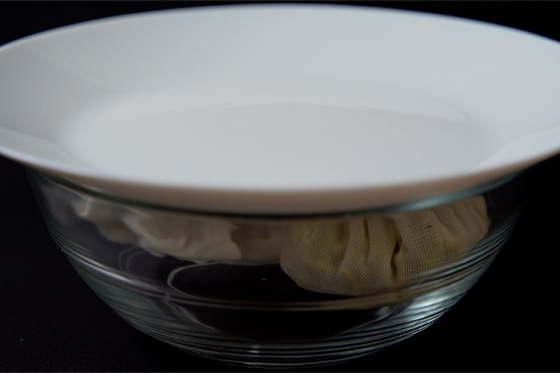 white glass lid on top of a glass bowl