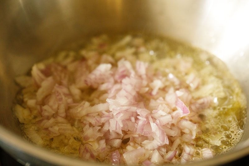 finely chopped onions added to hot oil in pan. 