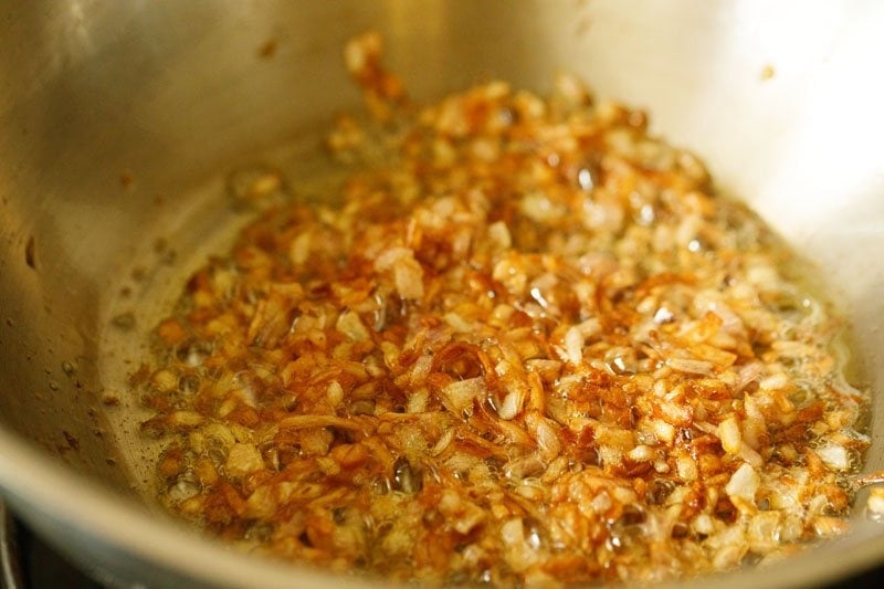 sautéing the onions in the pan till they turn golden. 