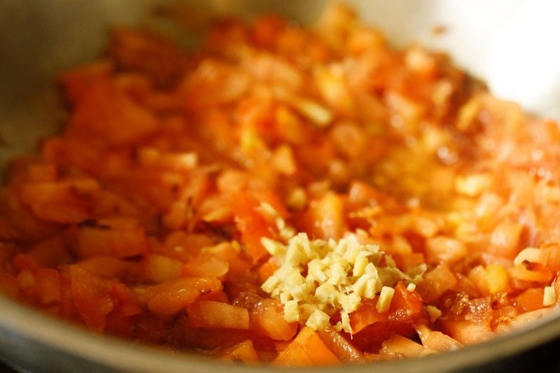 finely chopped tomatoes and finely chopped ginger added to the onions in the pan. 