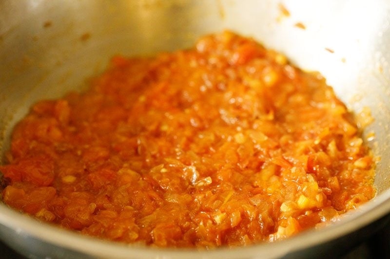 sautéing the onion-tomato mixture till the tomatoes turn soft and pulpy. 