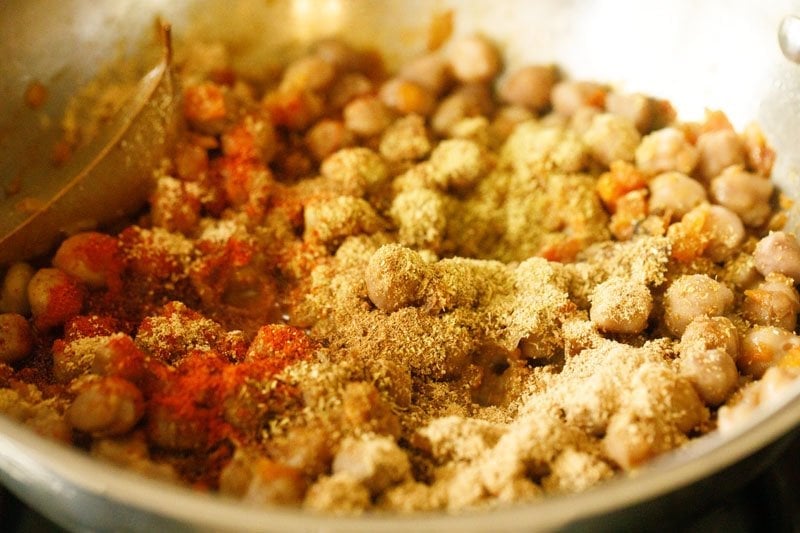dry spice powders added to the chickpeas mixture in the pan. 