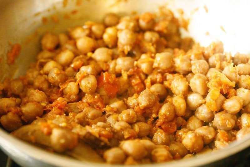 sautéing the spiced chickpeas mixture in the pan. 