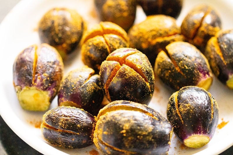 masala stuffed brinjals on a white plate