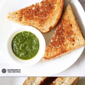 overhead shot of cheese sandwich triangle slices with cilantro dip on a white plate