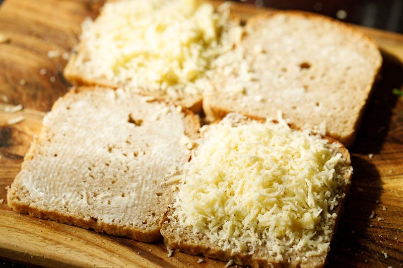 bread slices topped with grated mozzarella cheese