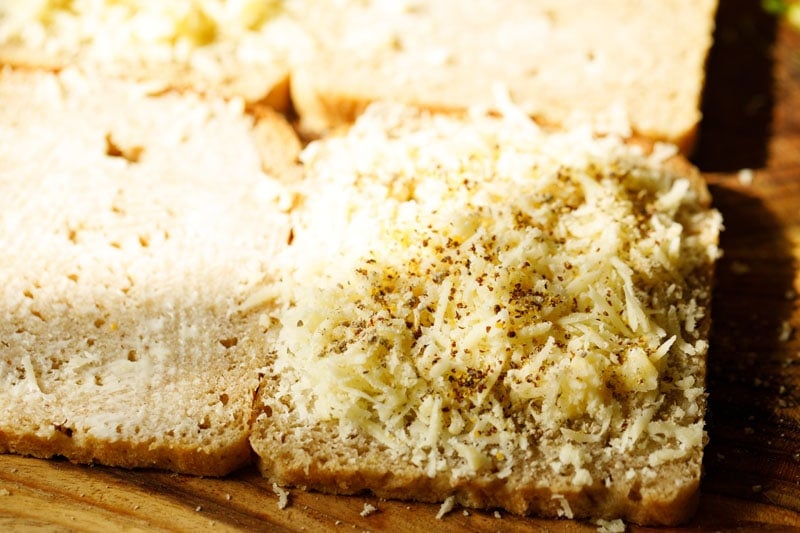 cheese topped with dried herbs, chili flakes, black pepper