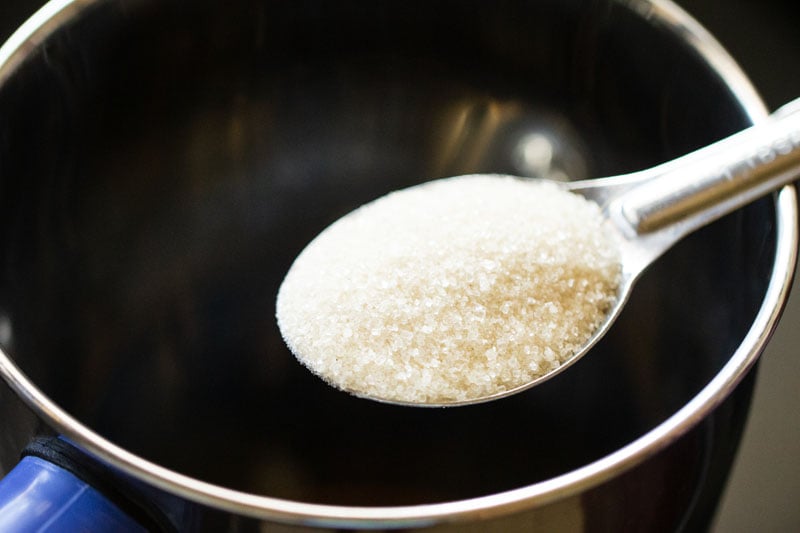 Adding sugar to the blender
