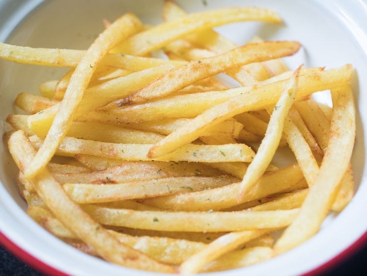 french fries recipe after tossing with seasonings and herbs