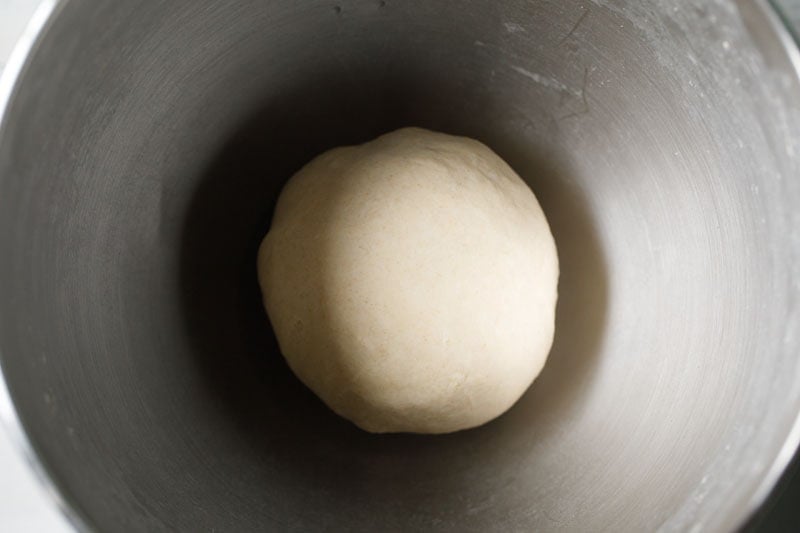 ball of garlic naan dough in bowl