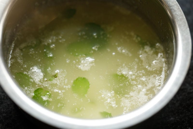 mint leaves floating in melted butter