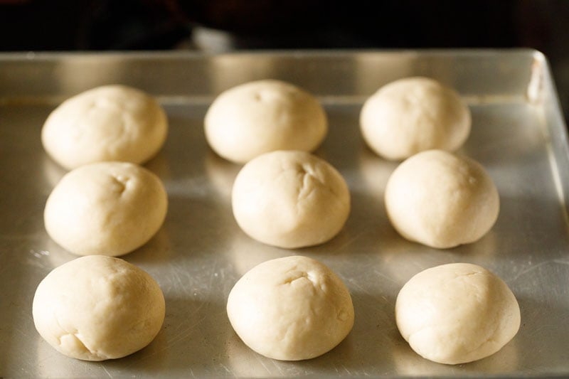 neat round balls of dough placed on metal tray