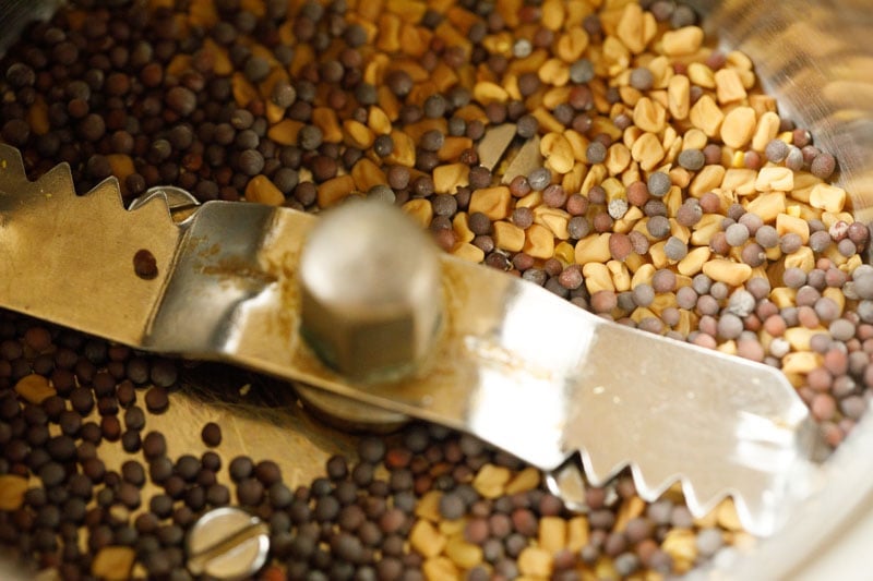 fenugreek and mustard seeds added to spice grinder