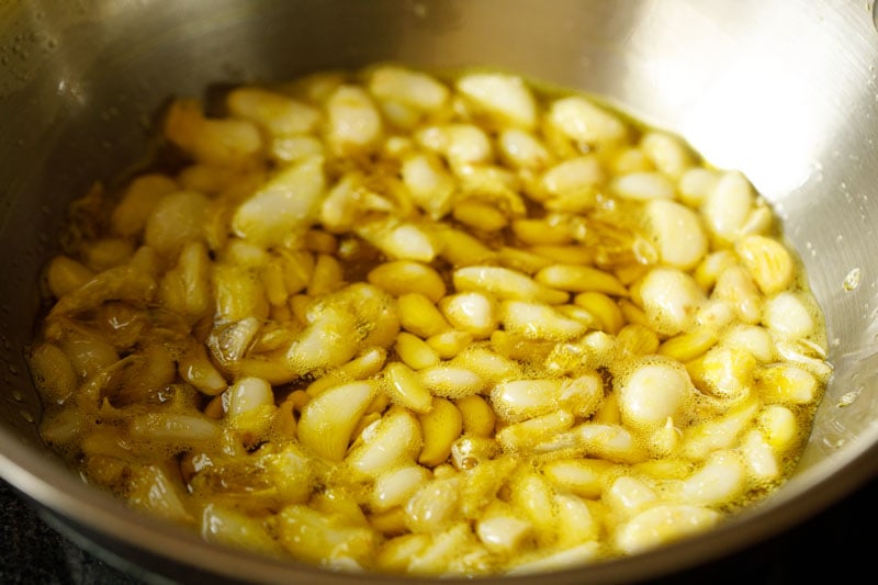 garlic cloves in mustard oil after frying