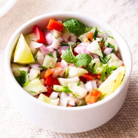 kachumber salad in a small white bowl