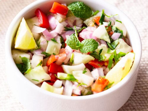 kachumber salad in a small white bowl