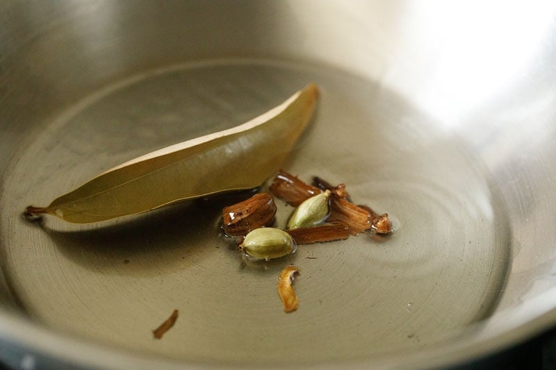 whole spices frying in oil