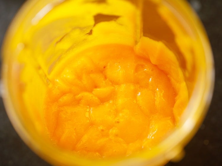 chopped mangoes blended to a thick pulpy mango juice
