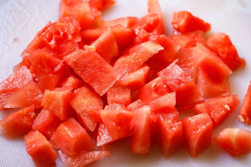 cubes of fresh watermelon on a cutting board