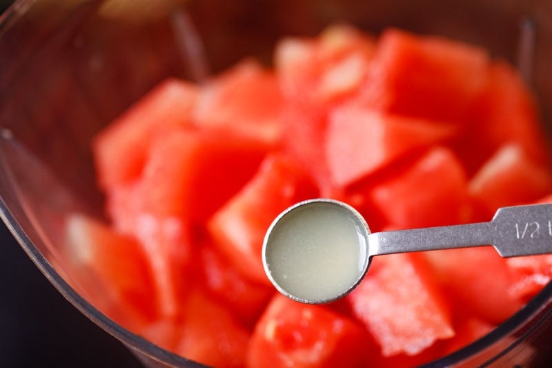 ½ teaspoon of lemon juice above blender with watermelon