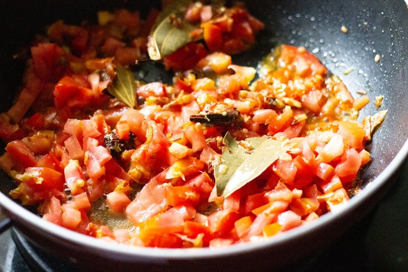 chopped tomatoes in the pan