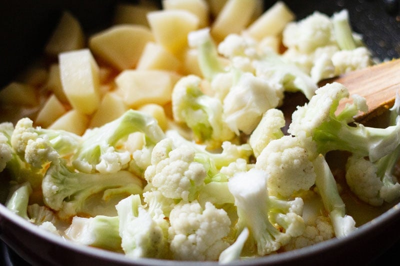 chopped cauliflower and potatoes in pan